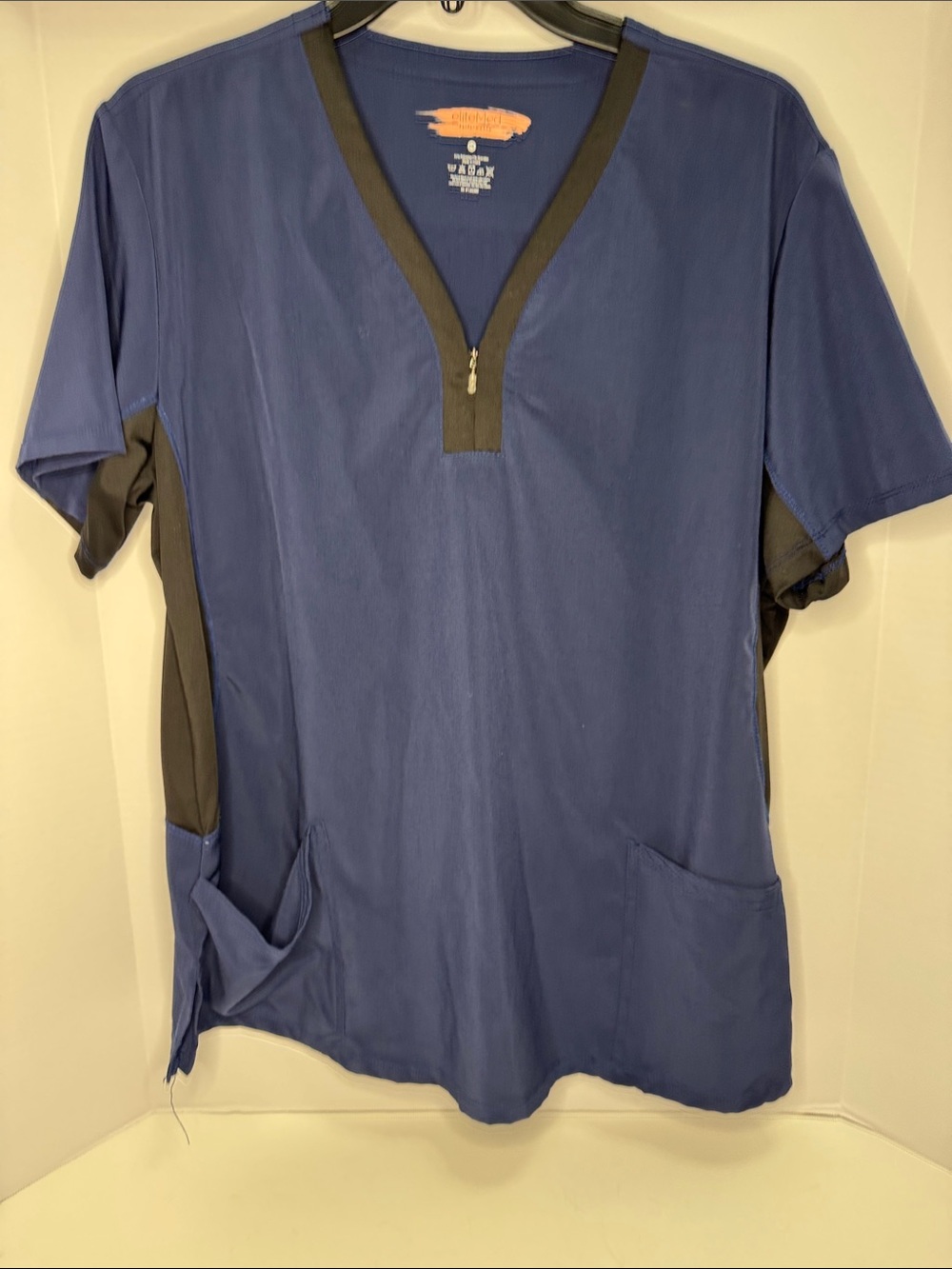 Woman’s Navy Blue V-neck Zip Scrub Top with Black Trim